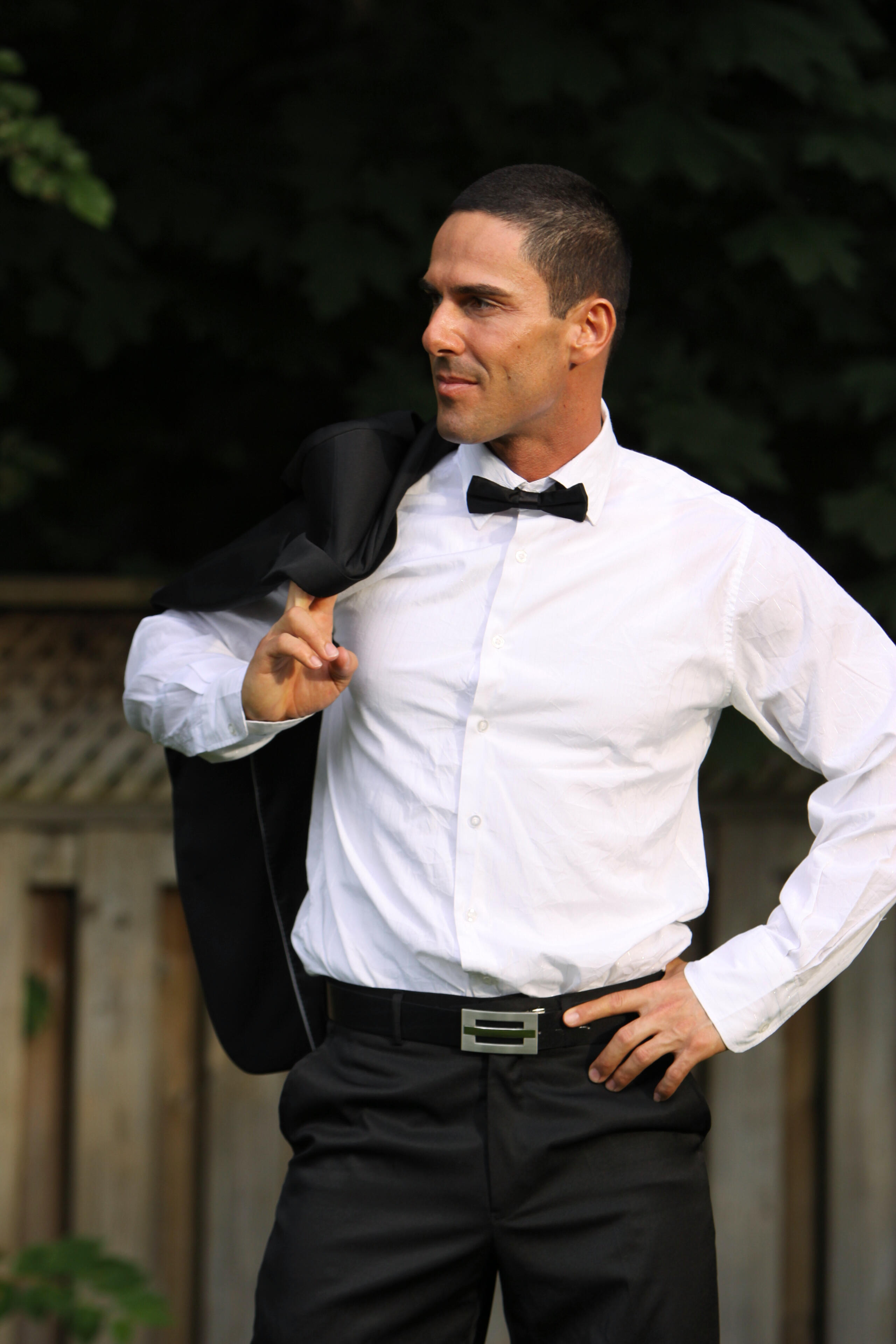 Performer Miguel Storm of Canadian Storm wearing a suit, white shirt and bowtie.